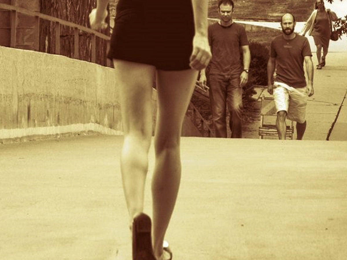 Person walking outdoors while working towards 10,000 steps a day