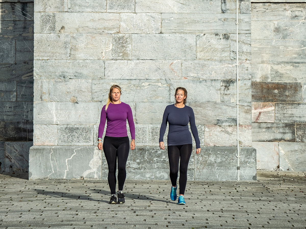 Two runners walking between training sessions during recovery