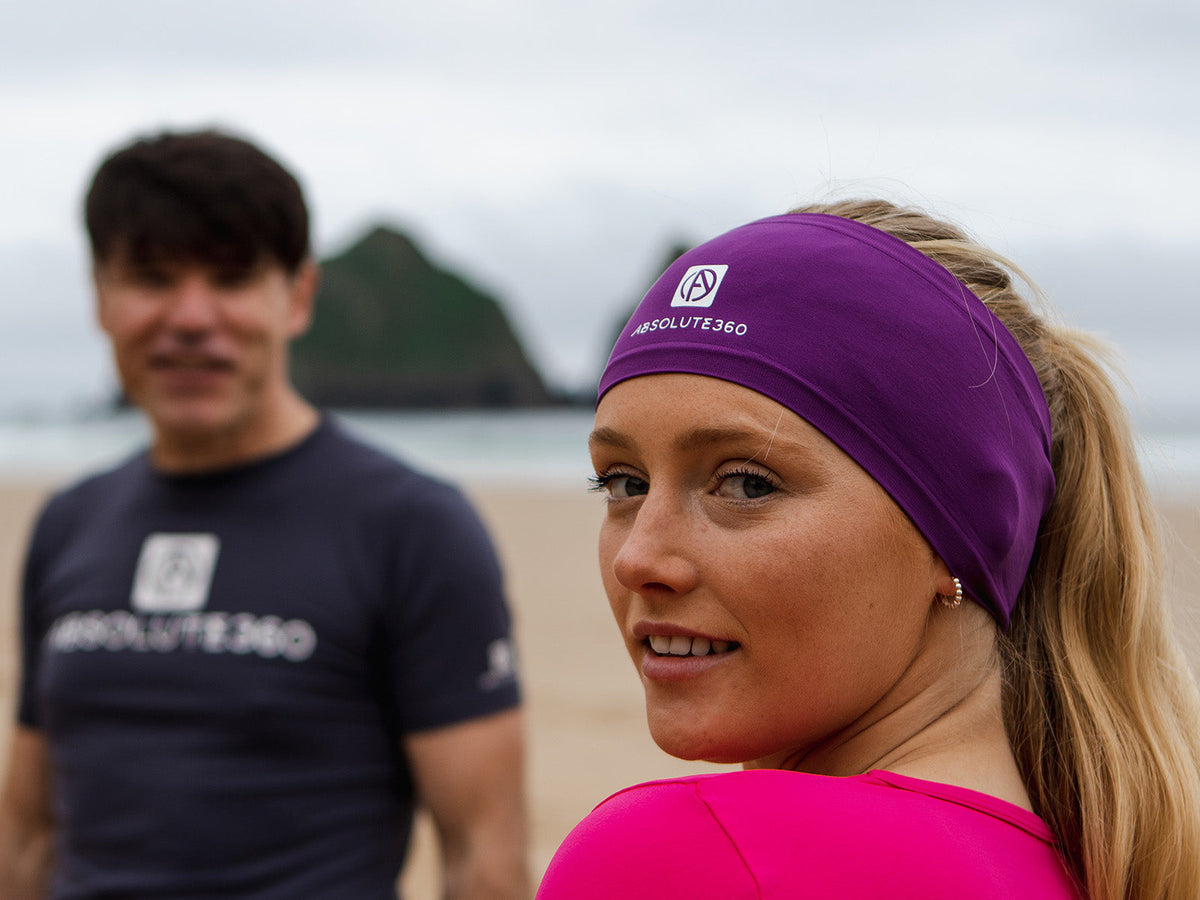 Runner wearing a purple ABSOLUTE360 wide performance headband