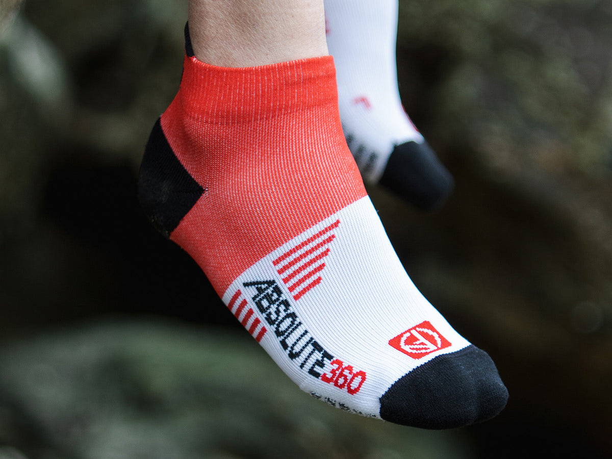 ABSOLUTE360 Performance Running Sock fitted closely around a runner's foot