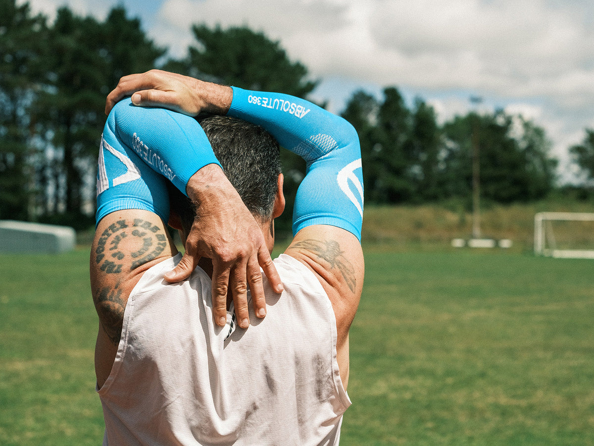Runner stretching in ABSOLUTE360® performance arm sleeves