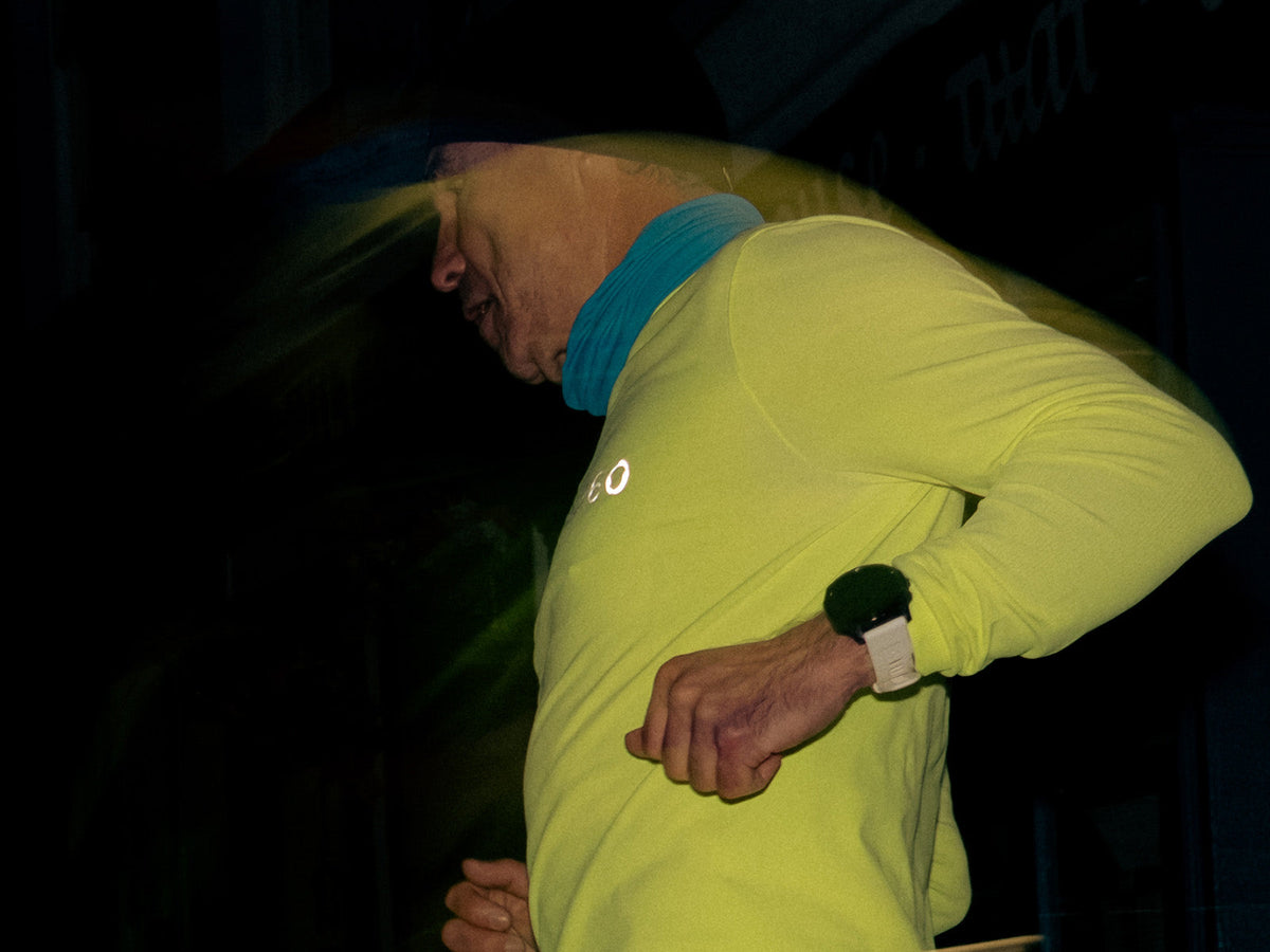 Runner wearing a neck warmer during a night run