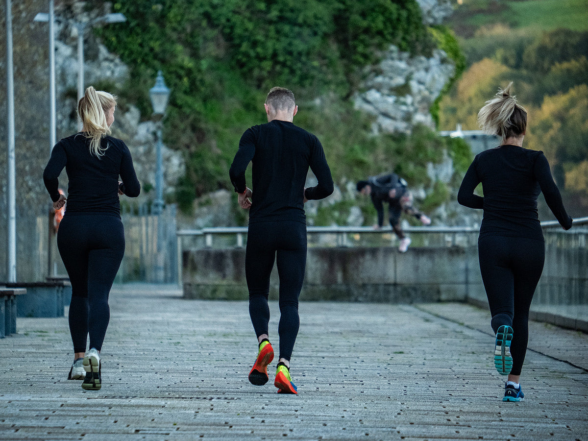 Three runners completing an easy recovery run at a relaxed pace