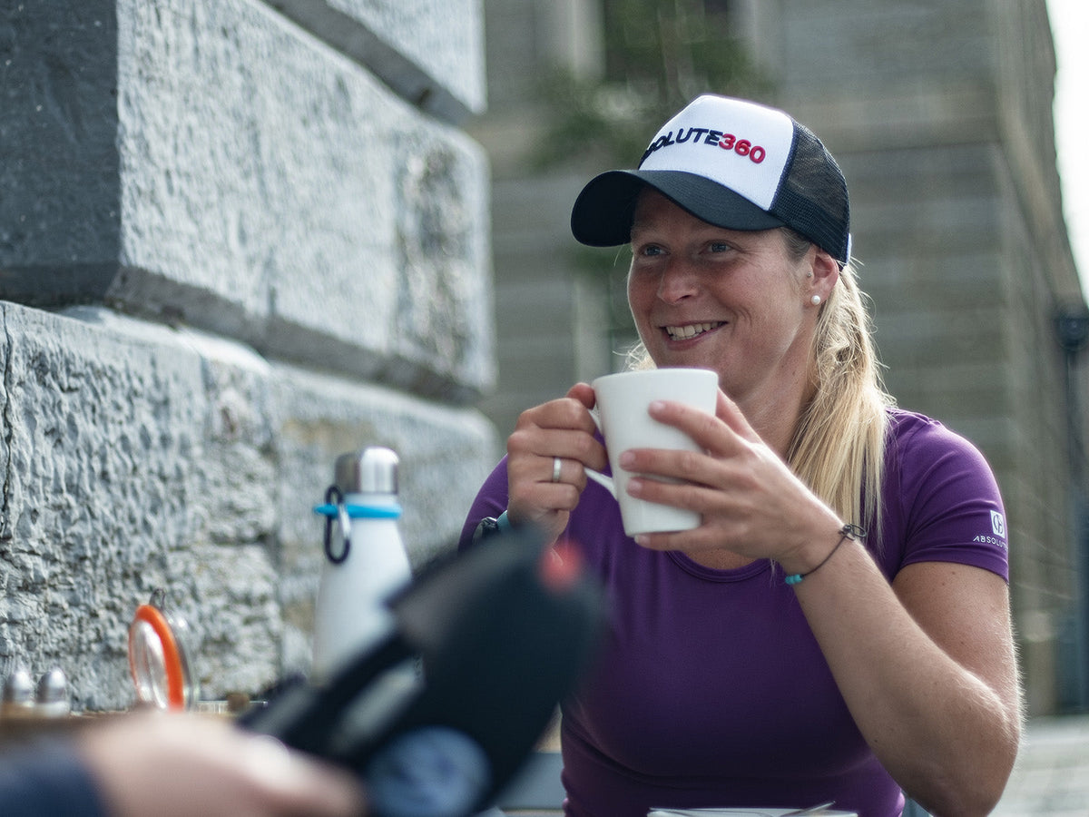 Runner having a drink after a run as part of post-run recovery