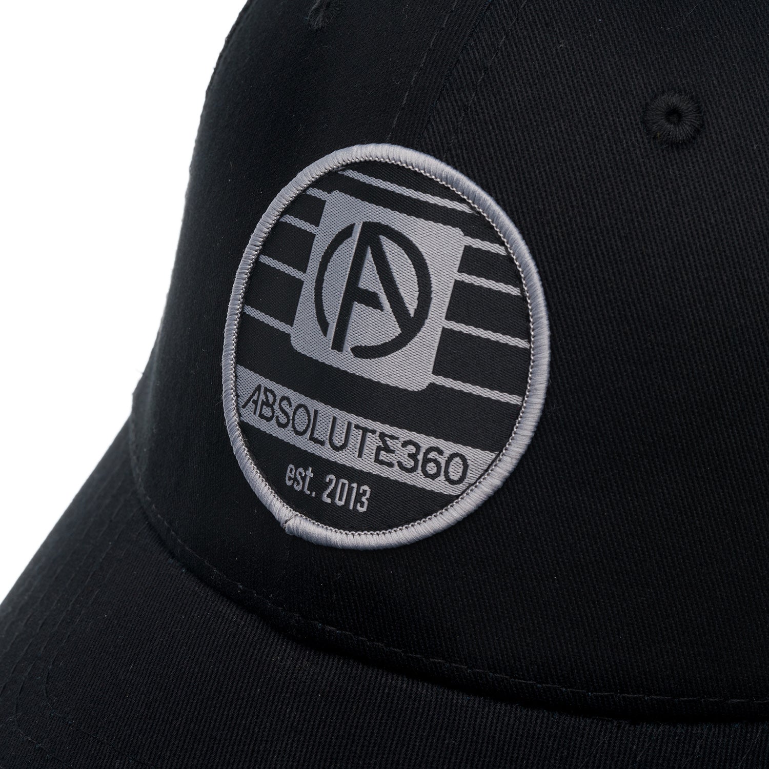 ABSOLUTE360 Heritage Trucker Hat in black, detailed woven patch