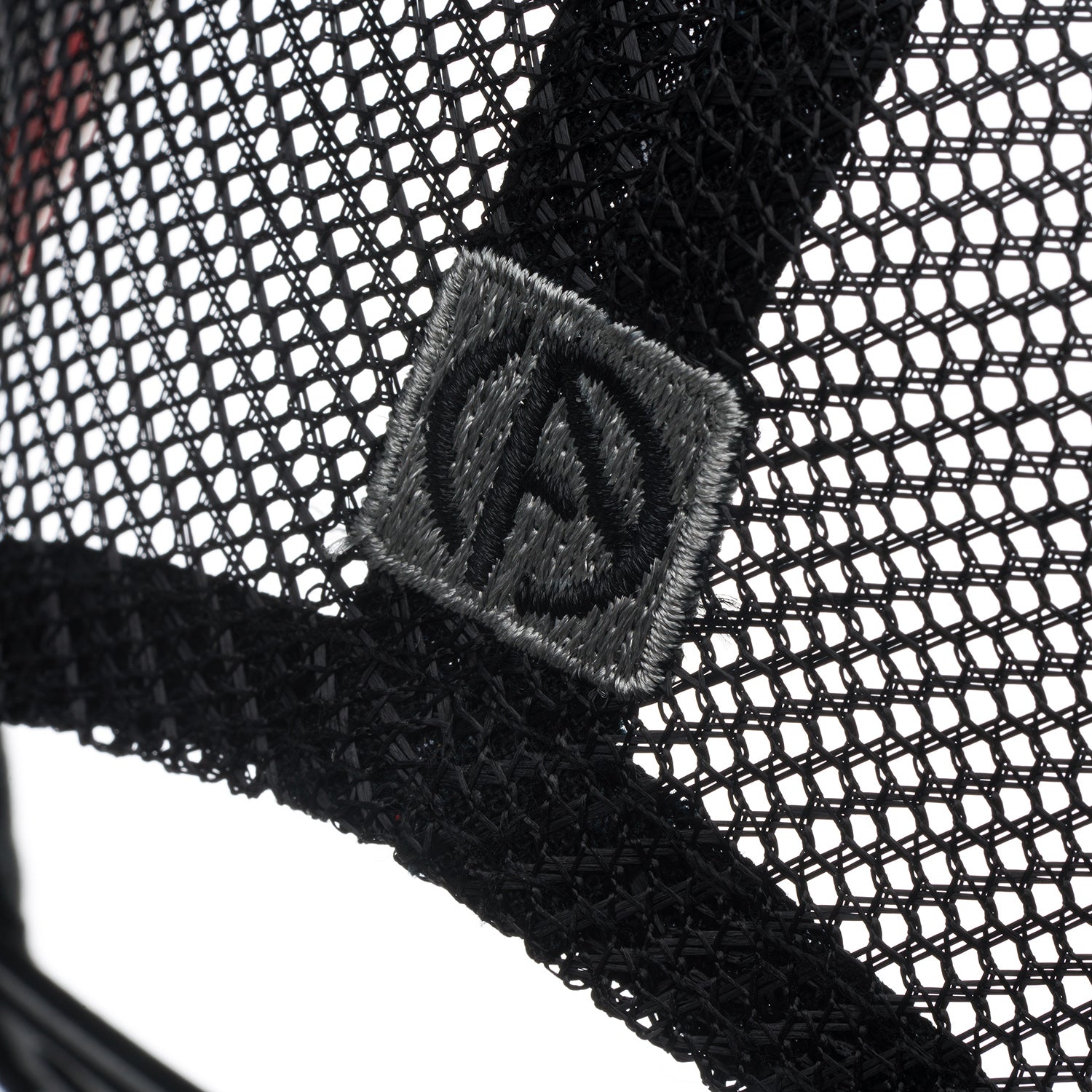 ABSOLUTE360 Heritage Trucker Hat in black, detailed mesh fabric with embroidered logo on white background