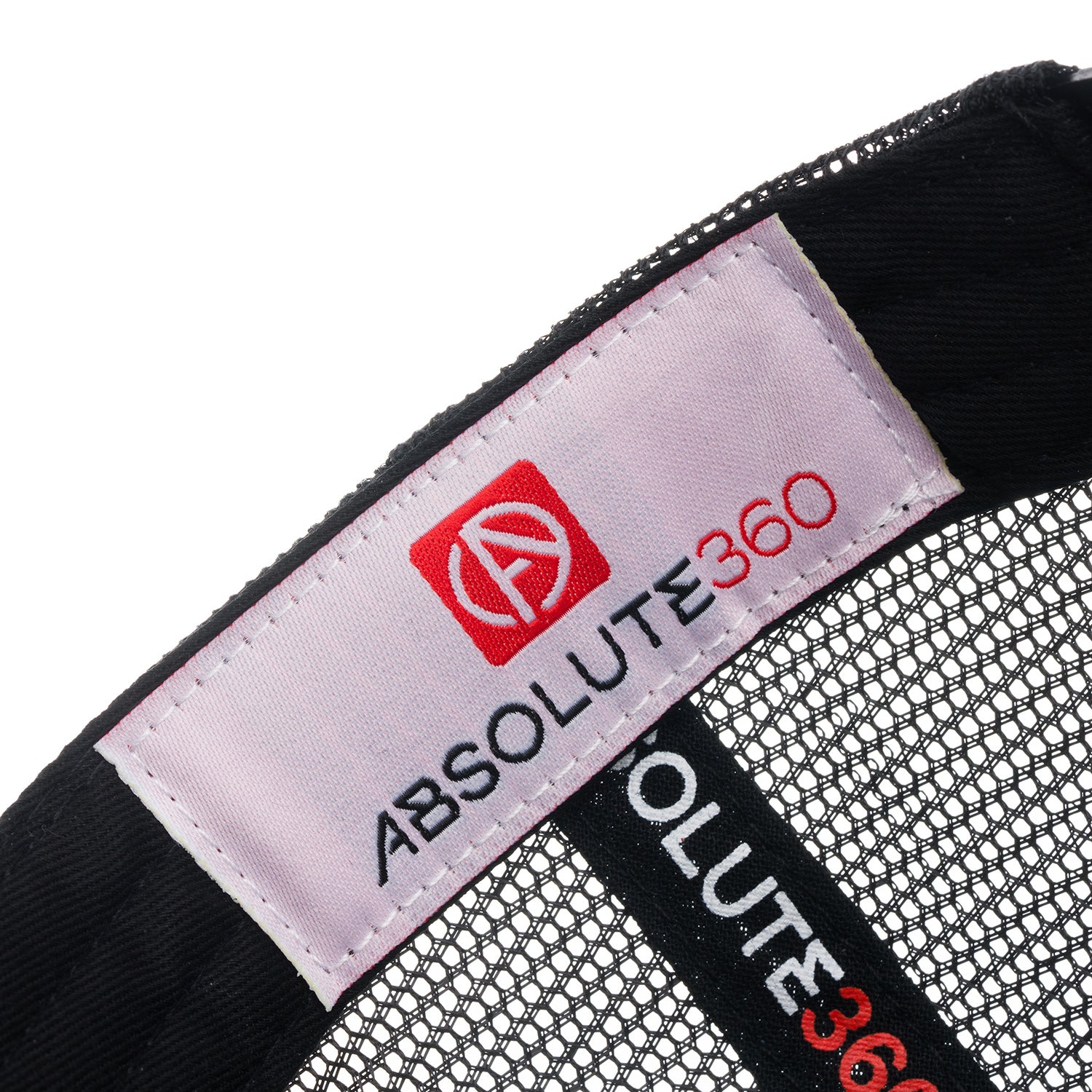 ABSOLUTE360 Signature Trucker Hat in white with black mesh, detailed woven label on white background