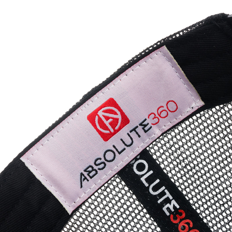 ABSOLUTE360 Signature Trucker Hat in white with black mesh, detailed woven label on white background